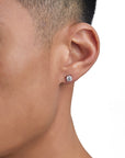 Model wearing white gold moissanite earrings by Iceman Society