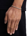 Model wearing 4mm 18K gold ice sparkler tennis chain set by Iceman Society, side view