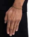 Model wearing 5mm 18K gold plain cuban chain set by Iceman Society, side view