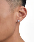 Model wearing moissanite earrings by Iceman Society