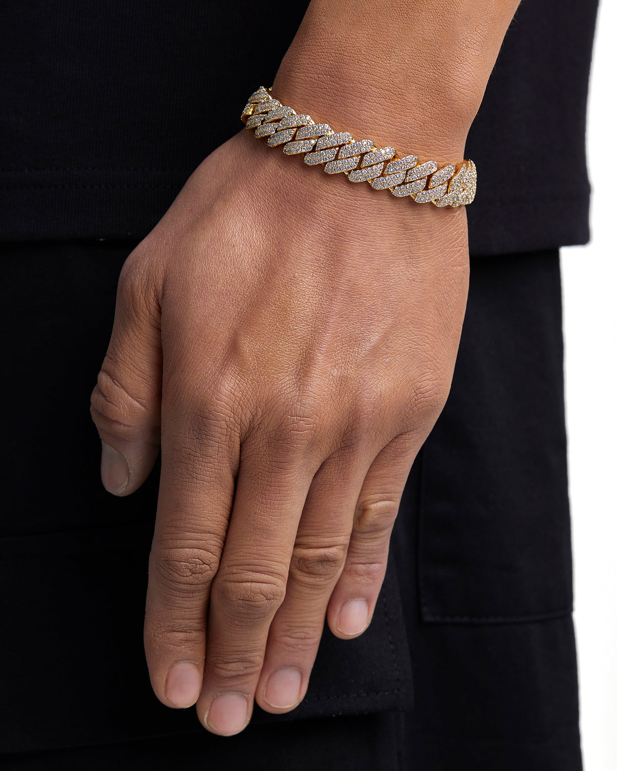 Model wearing 13mm 18K gold ice prong cuban chain set by Iceman Society, side view