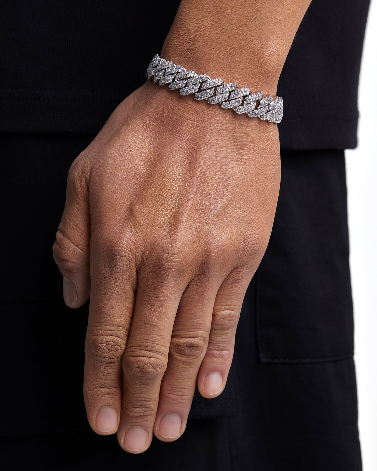 Model wearing 13mm white gold ice prong cuban chain set by Iceman Society, side view