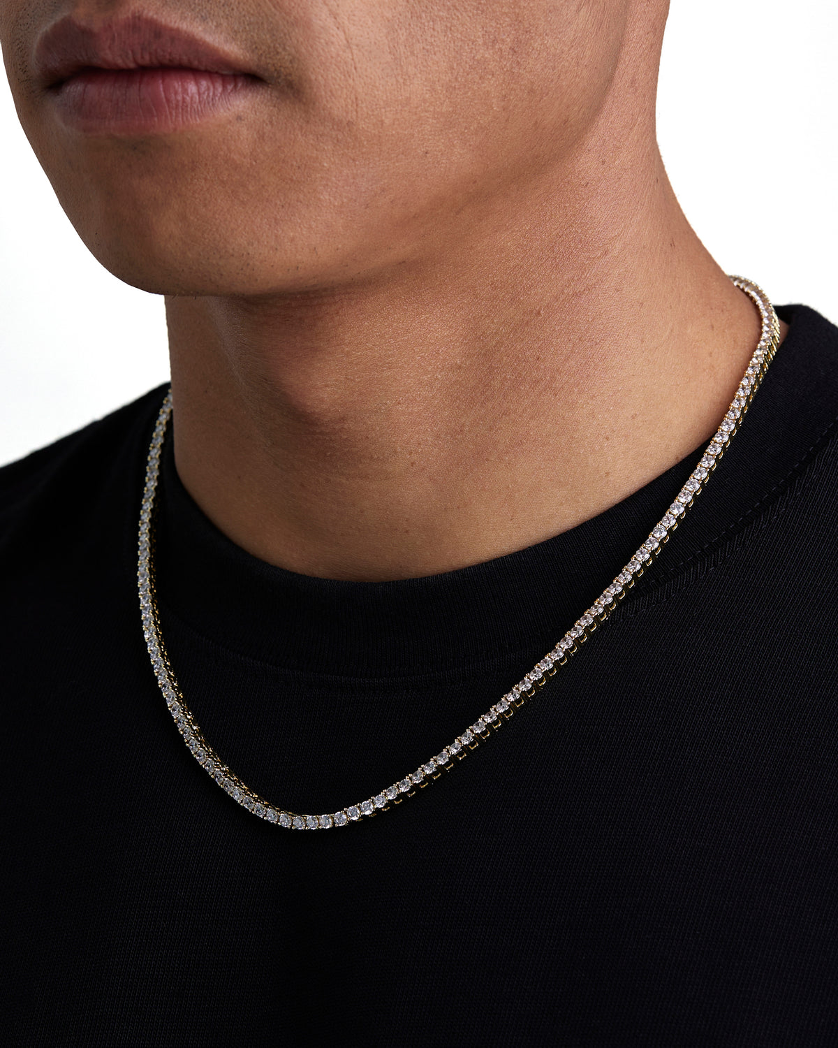 Model wearing 3mm 18k gold tennis necklace by Iceman Society, side view