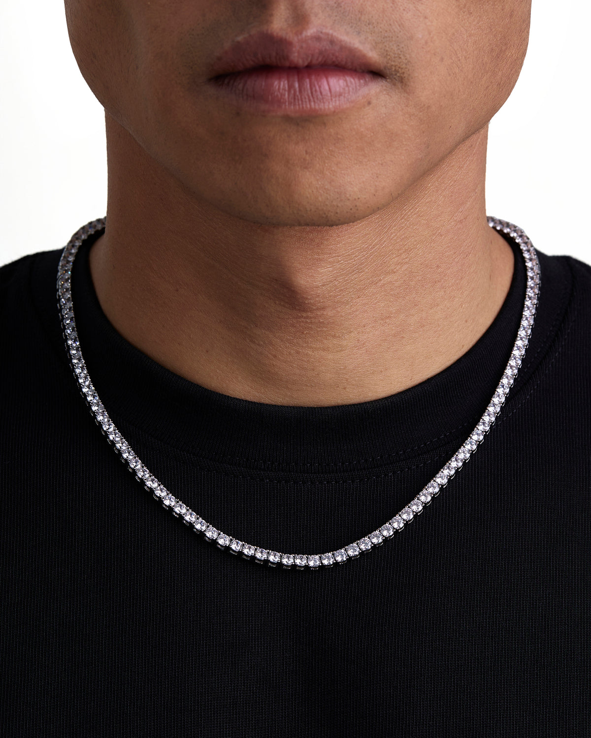 Model wearing 4mm white gold tennis necklace by Iceman Society, front view