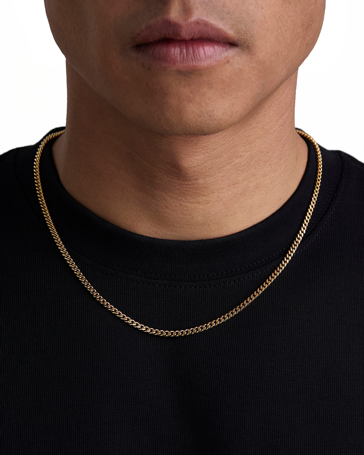 Model wearing 3mm 18k gold plain cuban necklace by Iceman Society