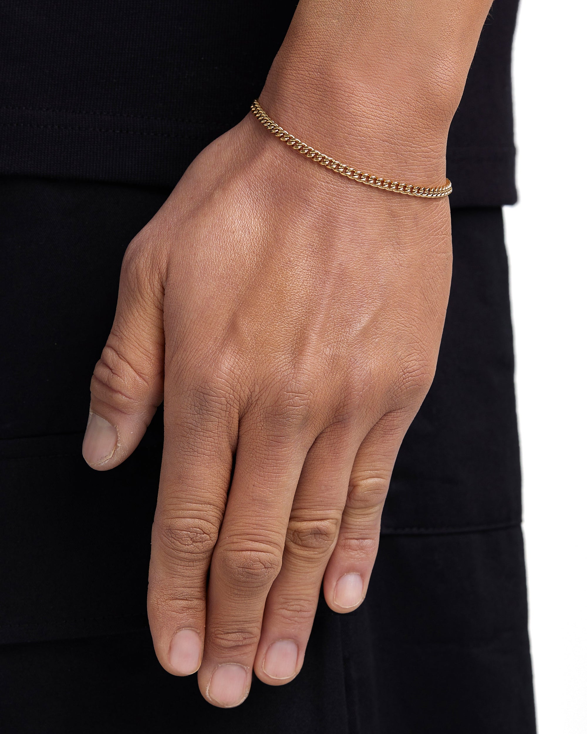 Model wearing 3mm 18K gold plain cuban chain set by Iceman Society, side view