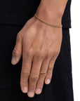 Model wearing 3mm 18K gold plain cuban chain set by Iceman Society, side view